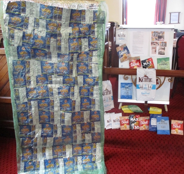 A sleeping bag for the homeless made from recycled crisp packets